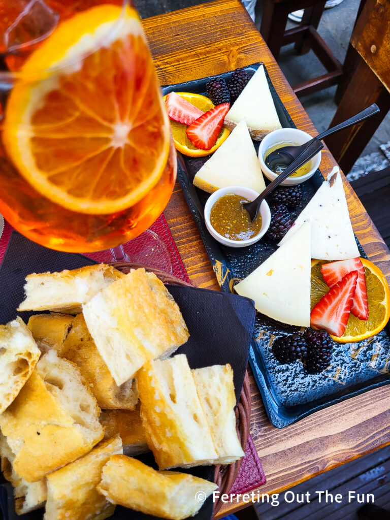 Aperol Spritz and cheese board at Note Di Vino wine bar in Florence