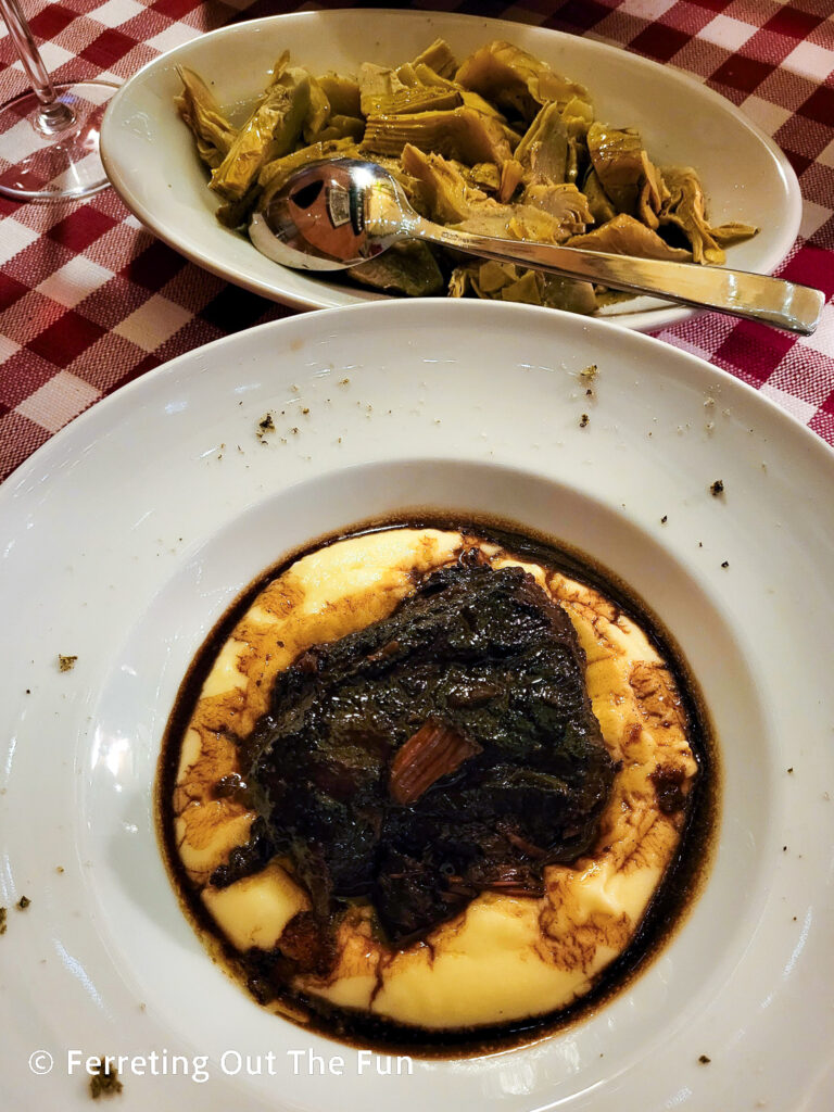 Classic Tuscan food - veal stew over mashed potatoes with sauteed artichokes